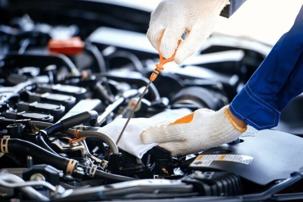 Mechanic working on car engine repairs